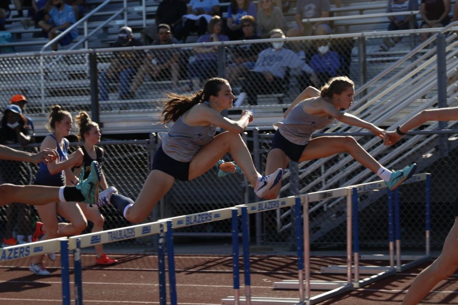 Clearing the next set at the same time, juniors Quincy Hubert and Reece Johnston compete in the 100m hurdles.  Hubert placed 2nd and Johnston placed 3rd.