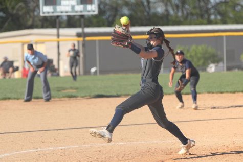 Winding up her arm, sophomore Adysin Hopkins throws the ball toward home plate Thursday, May 6. 