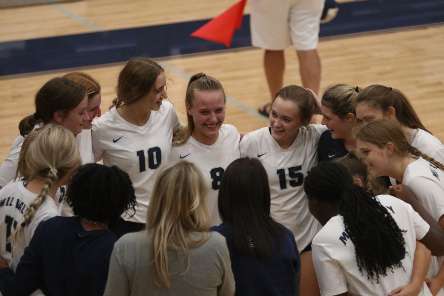 During a time-out, the team huddles together and discusses how they are playing.