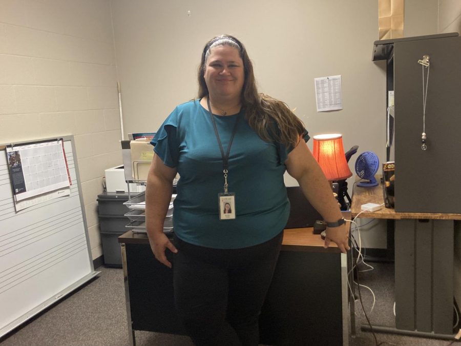 After being hired on late in the summer, new assistant band director Jennifer Whyte stands in front of her desk.