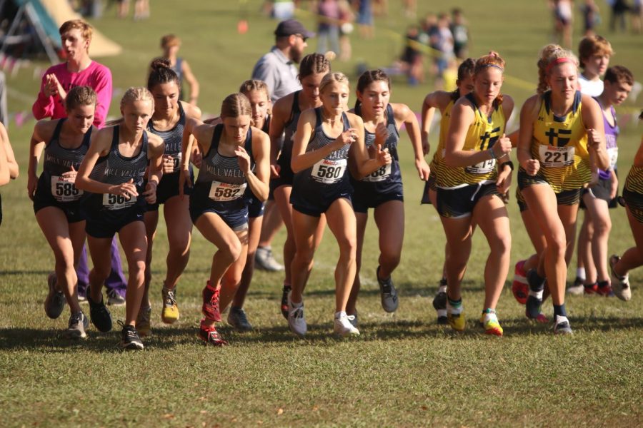 Sprinting at the sound of the starting pistol, the girls team disperses from the chute.