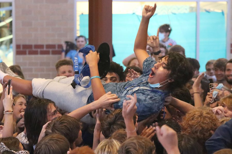 Hoisted in the air by his classmates, senior Danny Talavera crowd surfs.