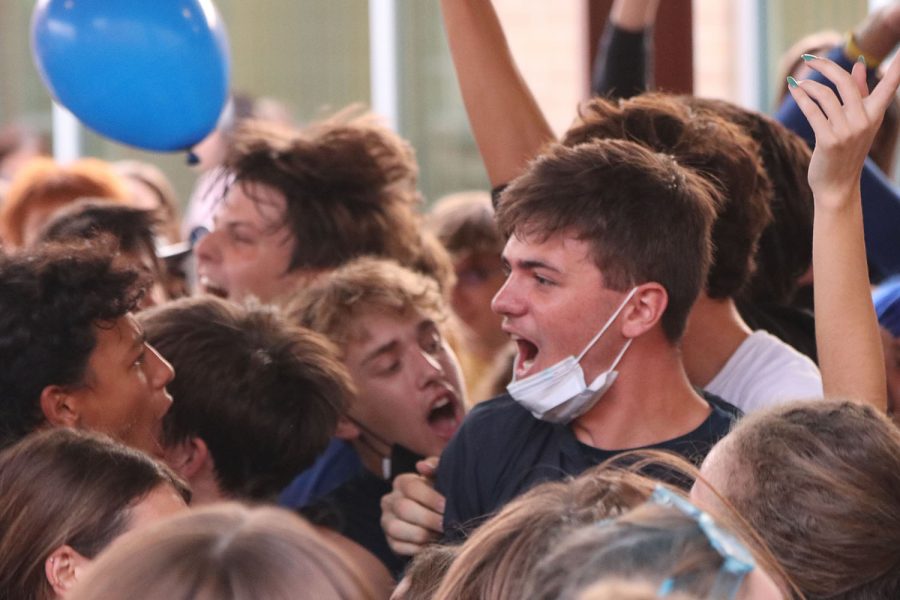In the center of the mosh pit, senior Nick Brubeck yells the lyrics to the music.