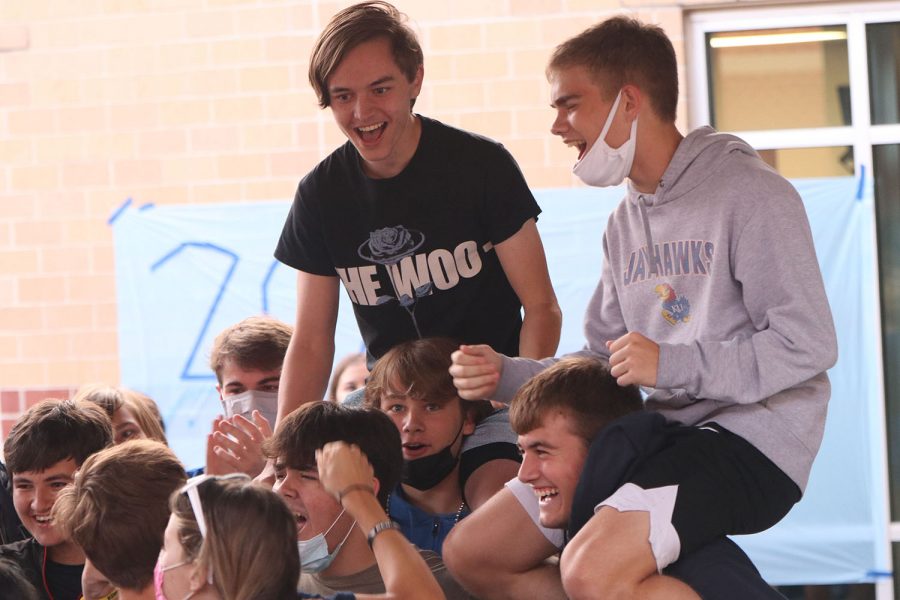 Lifted onto the shoulders of their friends, seniors Noah Carroll and Tyler Gross rise above the crowd.