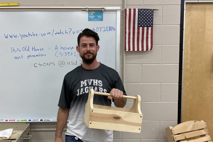 Holding+a+toolbox+example%2C+residential+carpentry+teacher+Cory+Sears+looks+forward+to+teaching+students+the+basics+of+woodworking.
