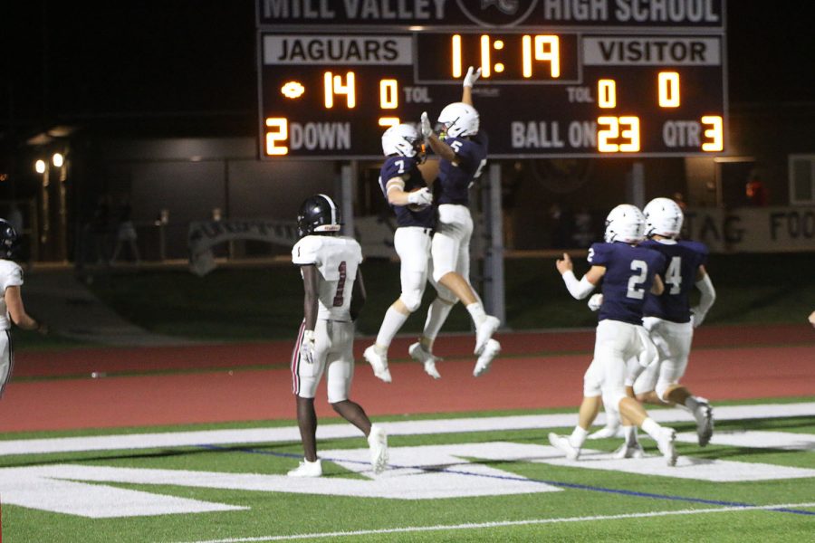 Celebrating another touchdown, seniors Kendrick Jones and Jared Napoli chest-bump mid air.