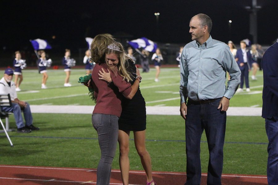 After being introduced, Homecoming queen candidate senior Katie Schwartzkopf embraces her mom.