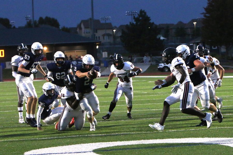 Reaching to make it into the end zone, junior Hayden Jay scores a touchdown.