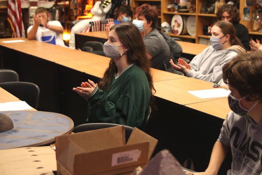 After the last presentation, junior Baylen Monson claps along with the class.