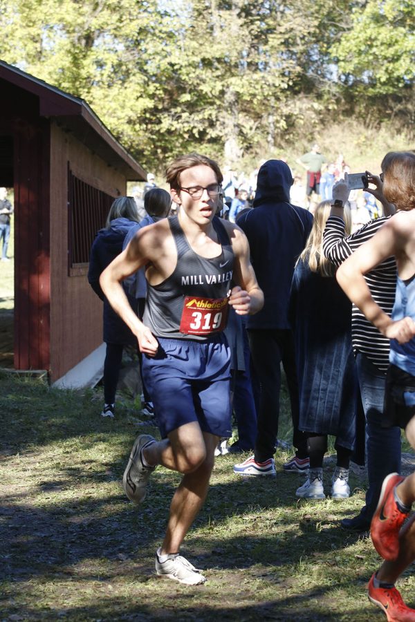 Giving it his all, senior Nic Botkin passes through the bridge.