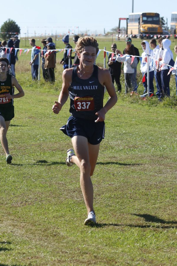 In the final stretch of the race, senior Jacob McGlasson sprints to the finish line.