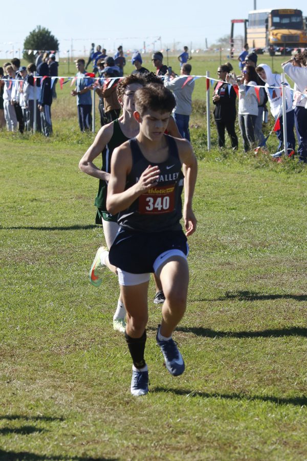 On the last stretch, junior Lucas Robins moves his arms for some momentum.