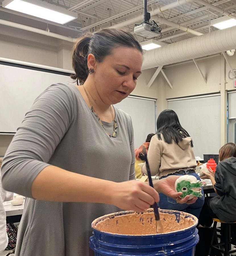 Art teacher Erica Crist prepares to mix the glaze for her students to decorate for their projects. 