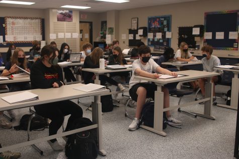 In a classroom full of masked students, Tuesday Oct. 19 will be the last day full masking is required by the Board of Education for high school students. 