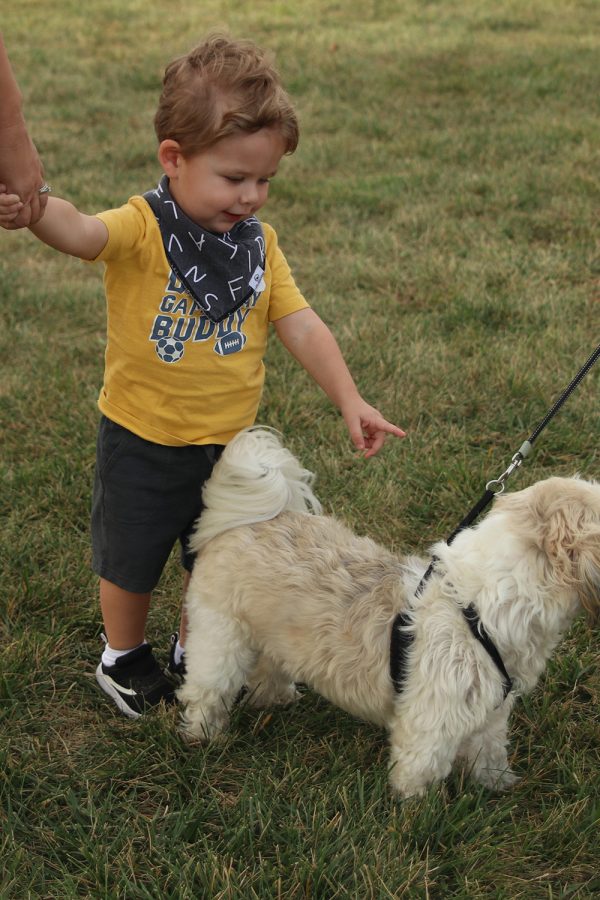 Pointing, participant Calvin Maddux enjoys meeting new dogs. 
