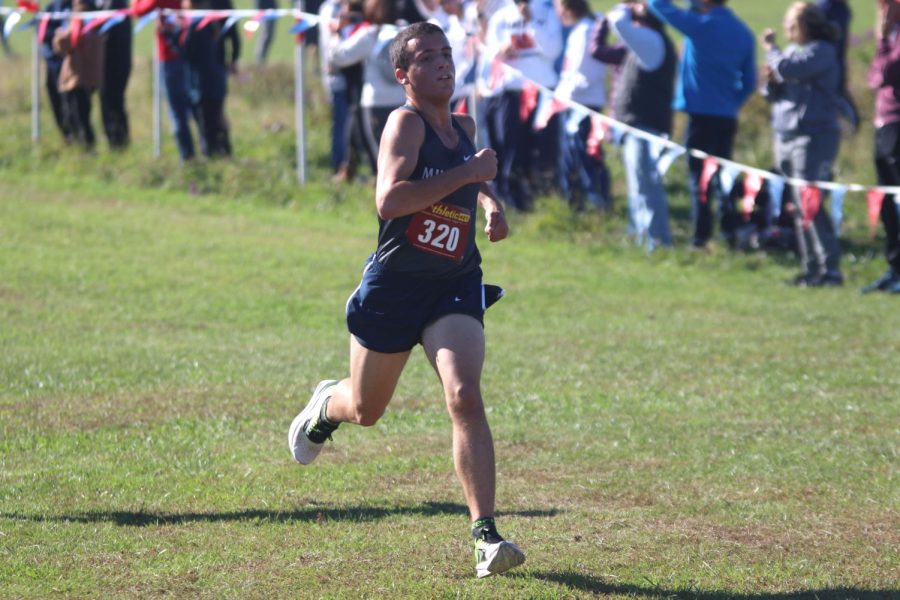 Senior Vinny Bruno sprints towards the finish line. 
