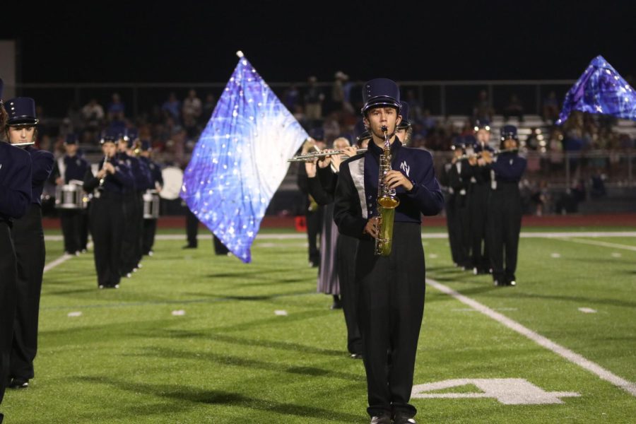 Senior Fischer Unruh stands in line with the rest of his section during the first movement of the marching show