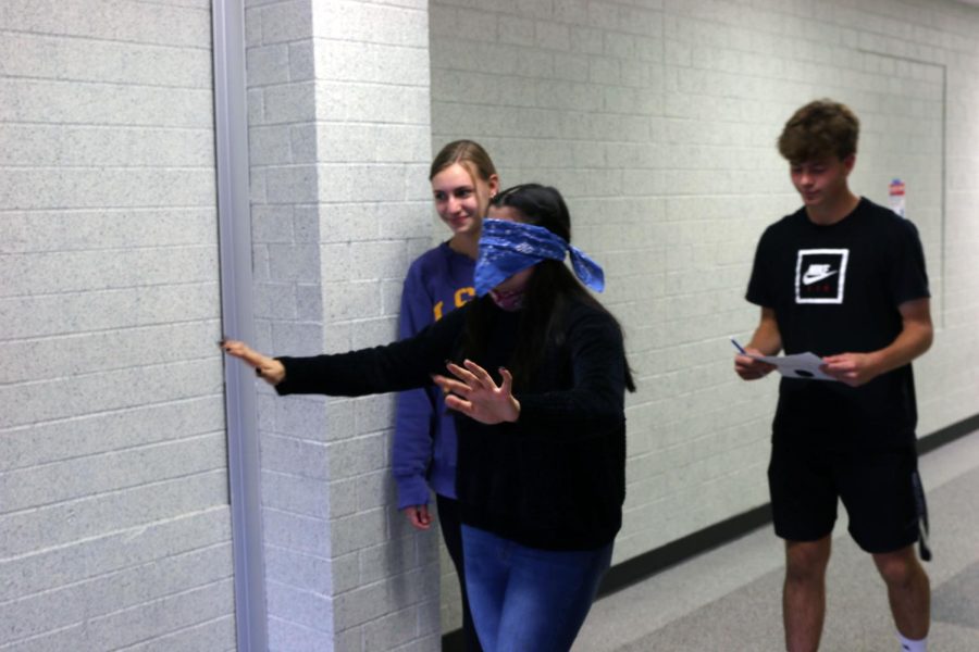 With her teammates following, sophomore Gabriela Gramajo makes her way down the hallway.
