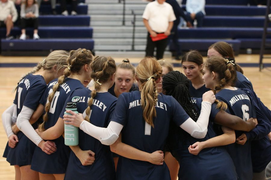 After falling in the first set against SJA 25-12, the team huddles together.