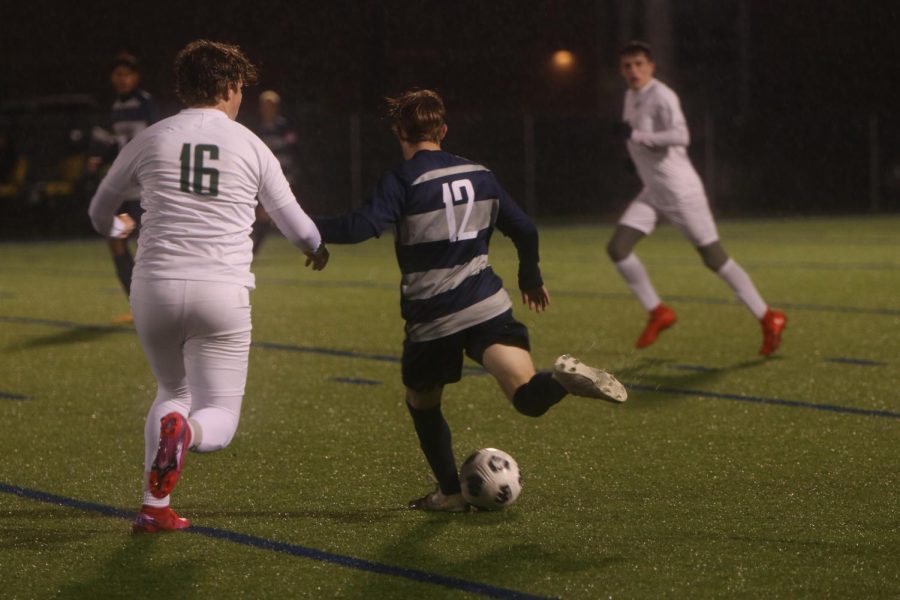 Junior Matt Morgan goes in to pass the ball to a teammate. 
