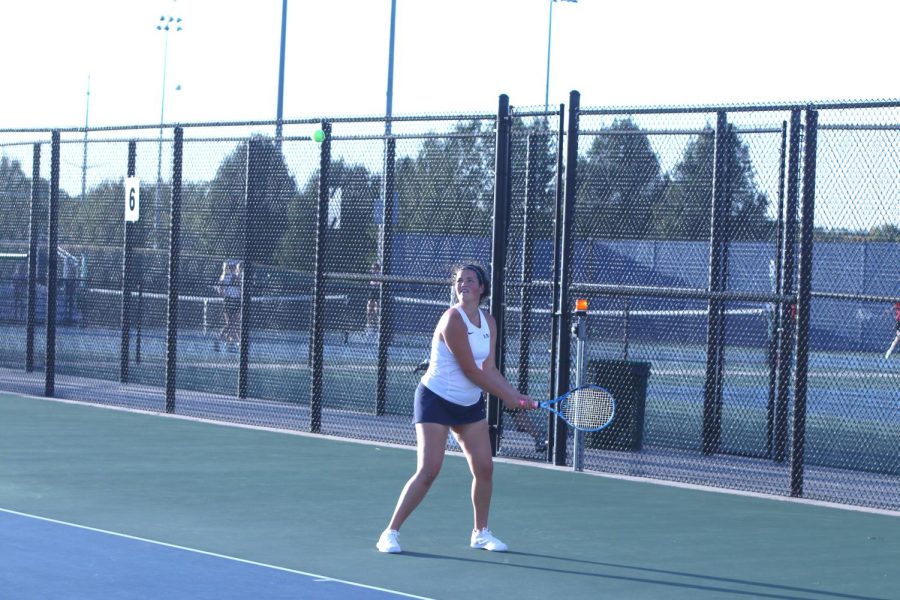 Hitting the ball, senior Sydney Wootton hopes to score a point. 
