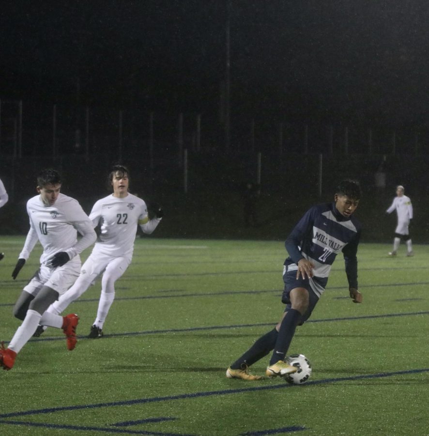 Senior Harrison Bensouda dribbles down the field after stealing the ball from the opposing team.