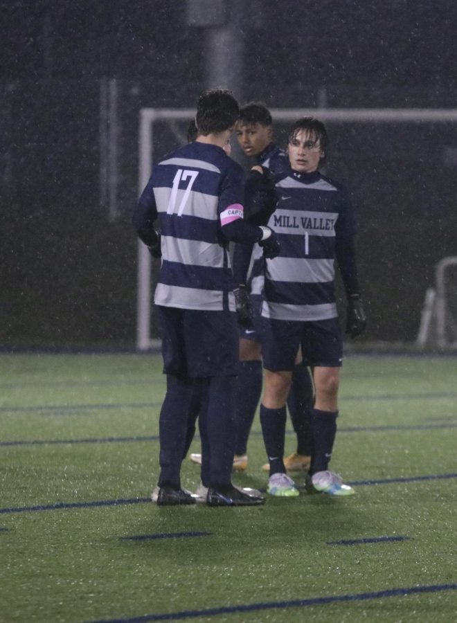 Team captain senior Ryan Wingerd talks to his teammates as they enter the field. 