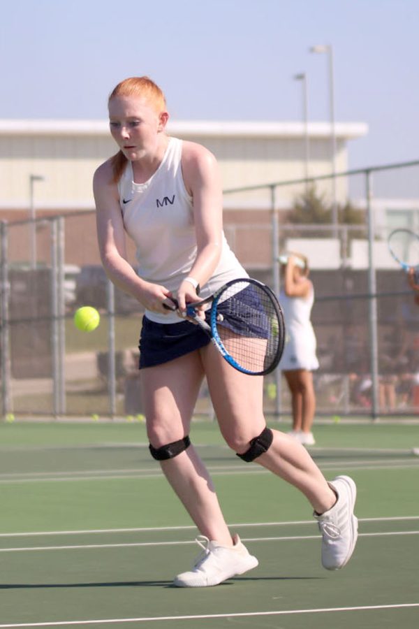 Eyes on the ball, senior Lauren Butler prepares to swing.