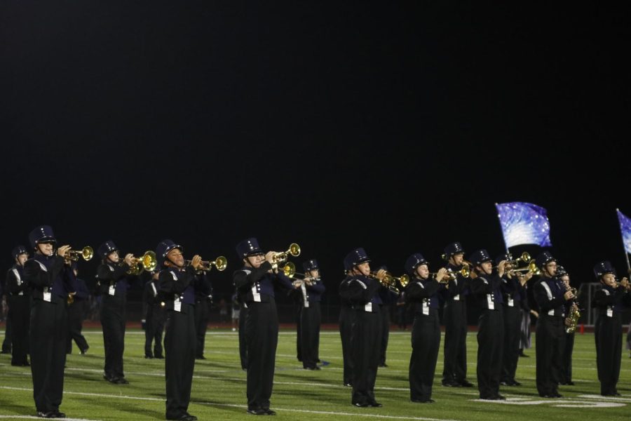 Standing in their closing set for their competitive marching show, the band plays out their last note