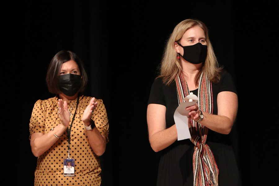 As they hold candles in their hands, Spanish NHS members recite the member oath during the ceremony Wednesday, Oct. 20.