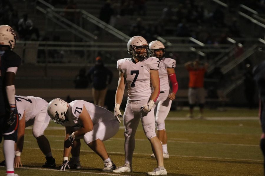 Looking to the sidelines, senior tight end Jared Napoli prepares for the next play.