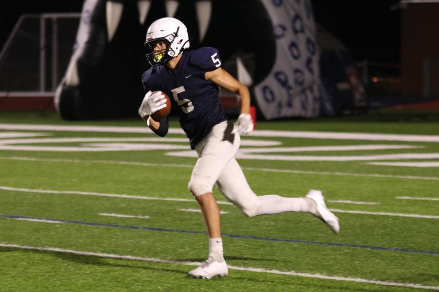 Senior Kendrick Jones breaks a tackle to continue a kickoff return.