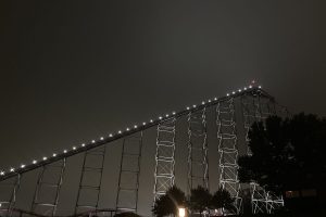 The Mamba, the tallest rollercoaster at the park, slowly climbs to the top of the tracks. 
