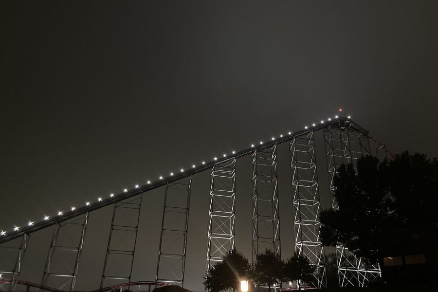 The Mamba, the tallest rollercoaster at the park, slowly climbs to the top of the tracks. 
