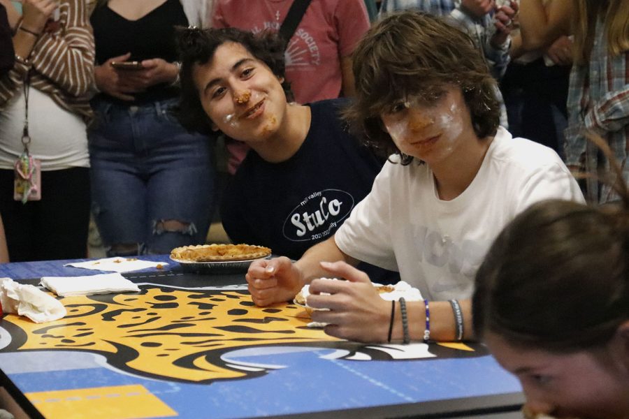 As they stare at their opponent, senior Danny Talavera and junior Eli Olson laugh as they pause during the pie eating contest. 