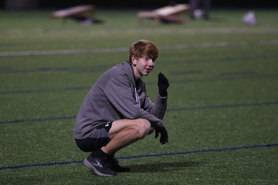 Standing in the outfield, sophomore Will Lehan bends down and stares at his teammate in defeat after letting the ball roll past. 
