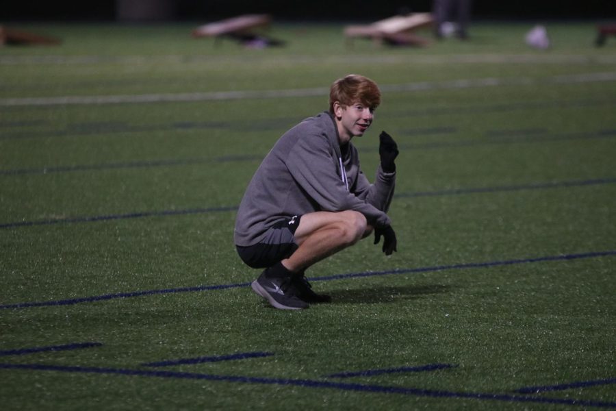 Standing in the outfield, sophomore Will Lehan bends down and stares at his teammate in defeat after letting the ball roll past. 