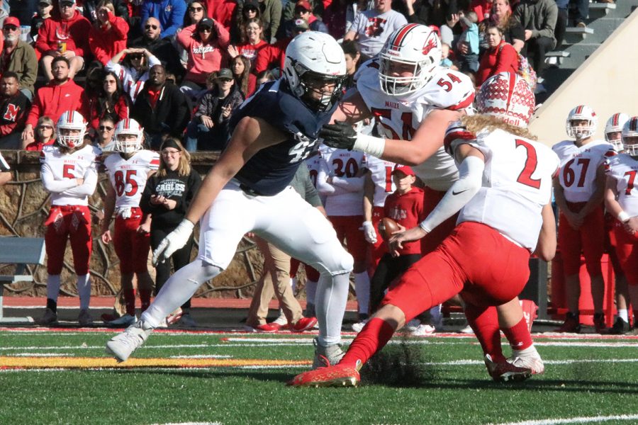 In front of the Maizes quarterback, sophomore defensive lineman Truman Griffith stares down his opponent before completing the sack. 