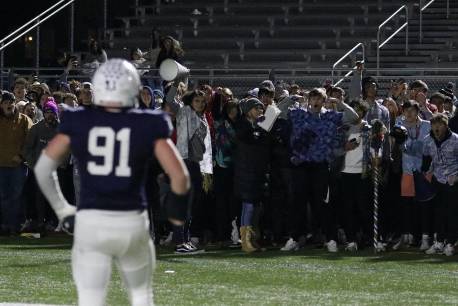 Looking out to the thrilled student section, senior Cody Moore gets the crowd loud once again.