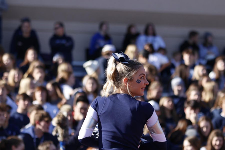 Looking out to the field, sophomore Madeline Epperson prepares to cheer for the jags. 
