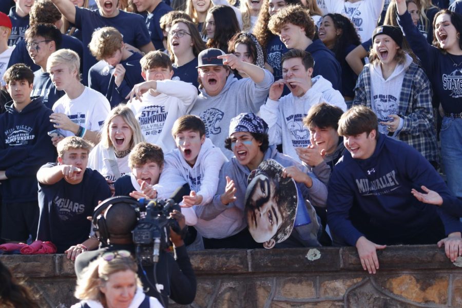 Looking to the camera, Mill Valley students cheer as loud as possible to show support to their team. 