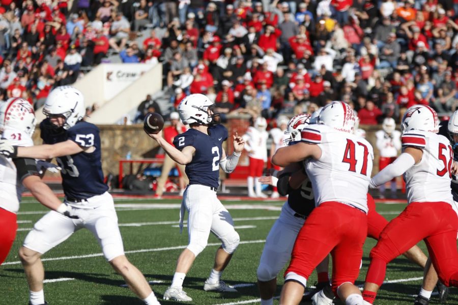 After finding his open receiver, junior Hayden Jay throws the ball to the endzone.