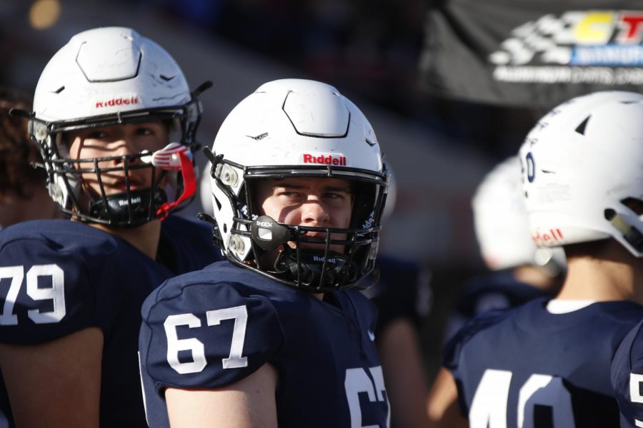 Looking to the screen, sophomore Jack Fulcher watches the defense play.