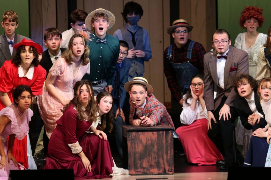 Junior Finn Campbell points the pool cue towards the audience as the rest of the cast looks out. The drama department performed The Music Man which will be shown Wednesday, Nov. 10, Thursday, Nov. 11, Saturday, Nov, 13 and Sunday Nov. 14.