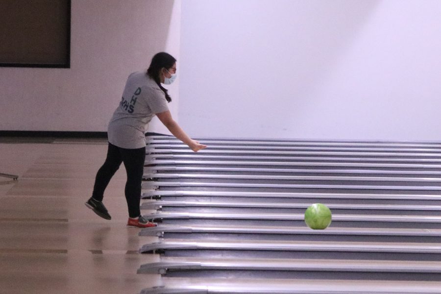 Throwing the ball, sophomore Mya Diacono bowls for the Unified Olympics Bowling team.