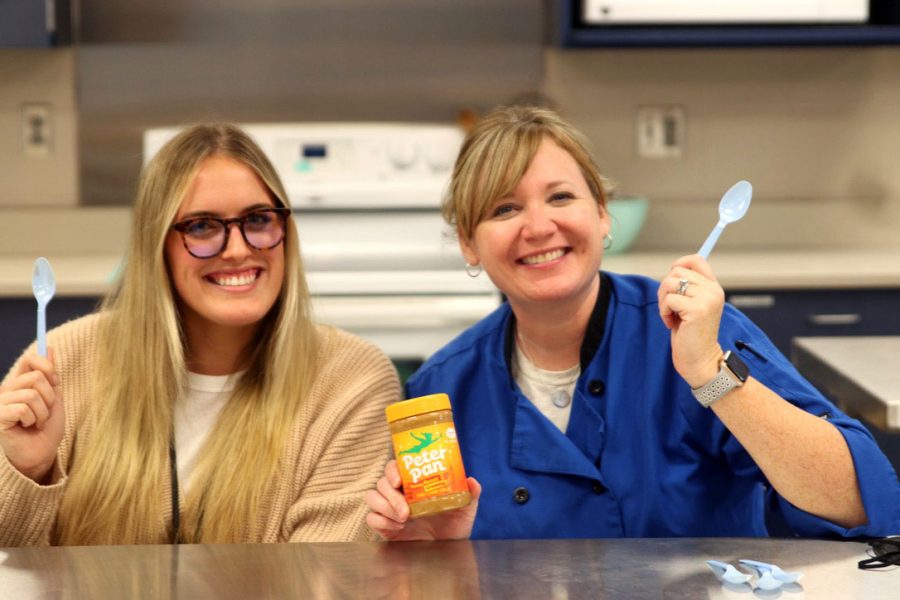 After their blind taste test, teachers Lauren Stringer and Margaret  Dieckoff pose with their top peanut butter choice on Thursday, Nov. 11