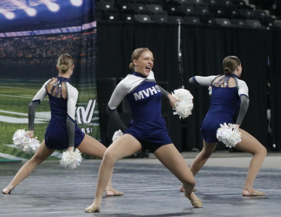 At front and center stage, freshman Ashley Ayers begins the performance routine.