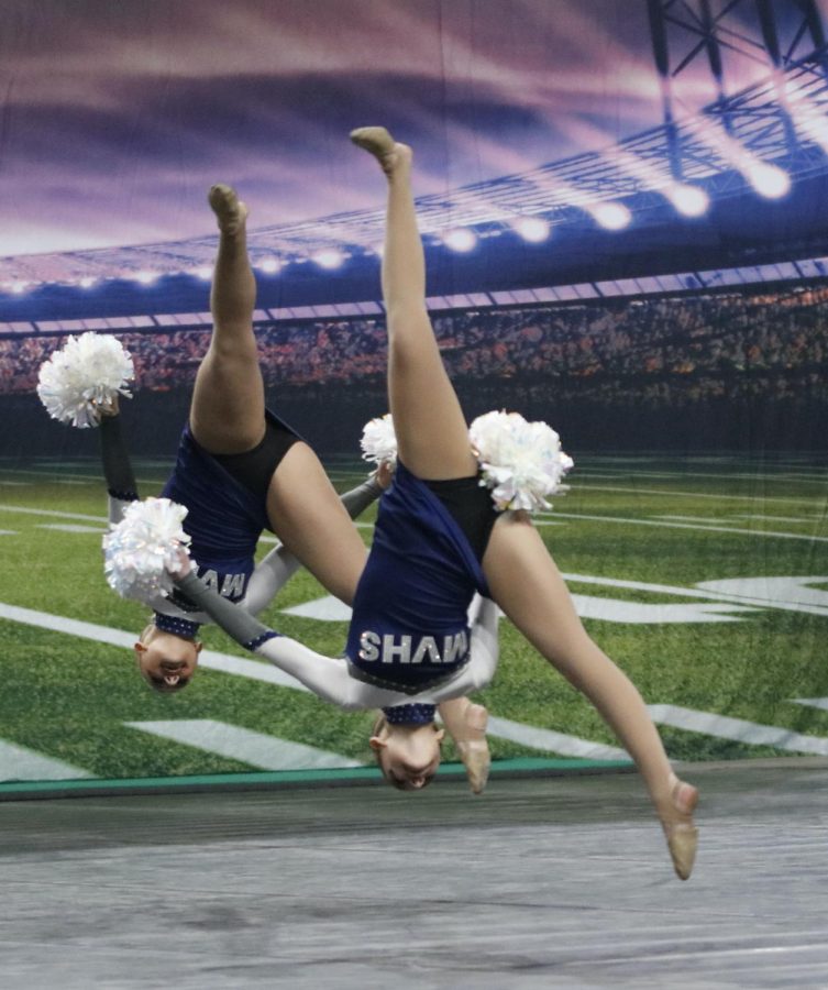 Upside-down during performance, sophomore Keira Bret completes an aerial.