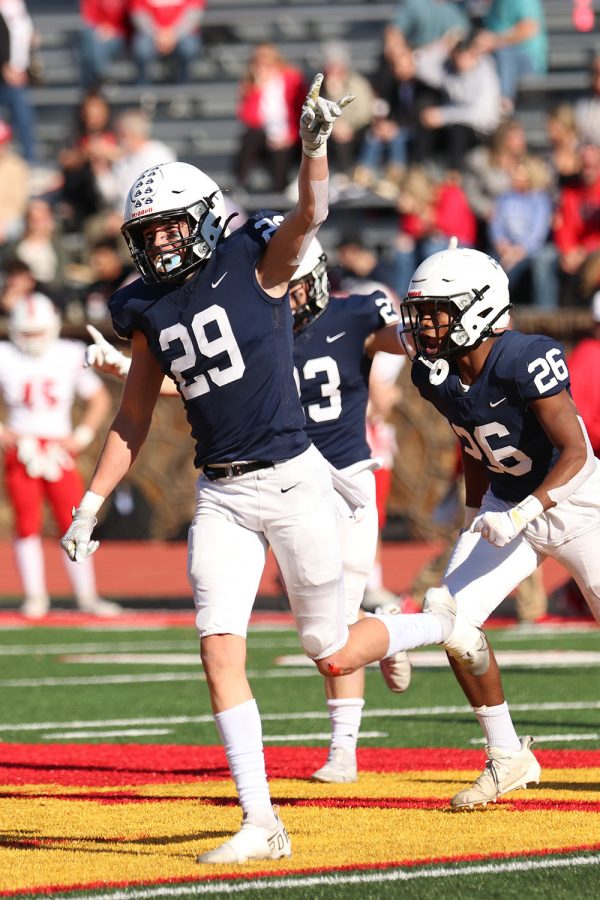 After the opposing teams quarterback is sacked, junior strong safety Dylan Massey celebrates. 