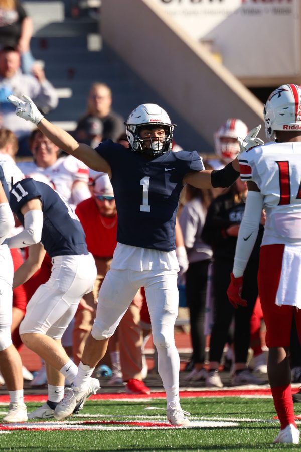 Celebrating, senior wide receiver Blake Boatwright signals to the referee after Mill Valley picks up a fumble.